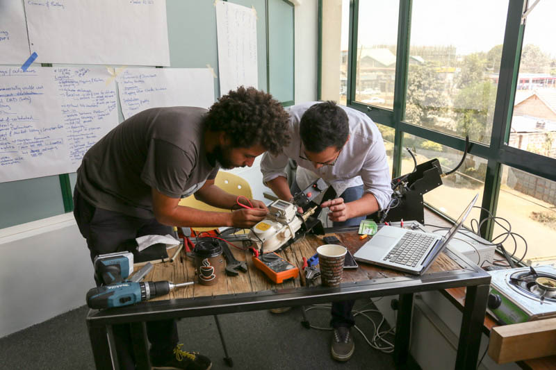 The Paygo team at work on their smart meter for cooking gas