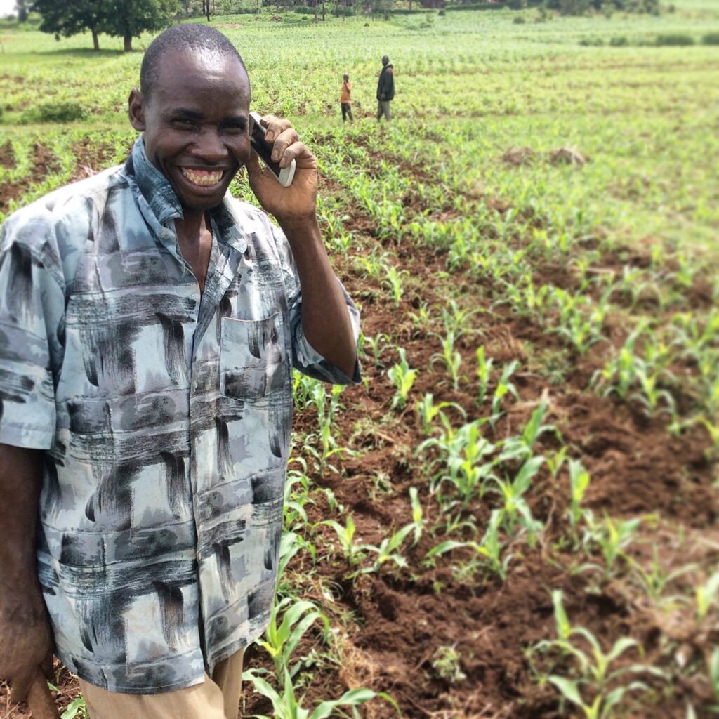 Pula customer on phone in field