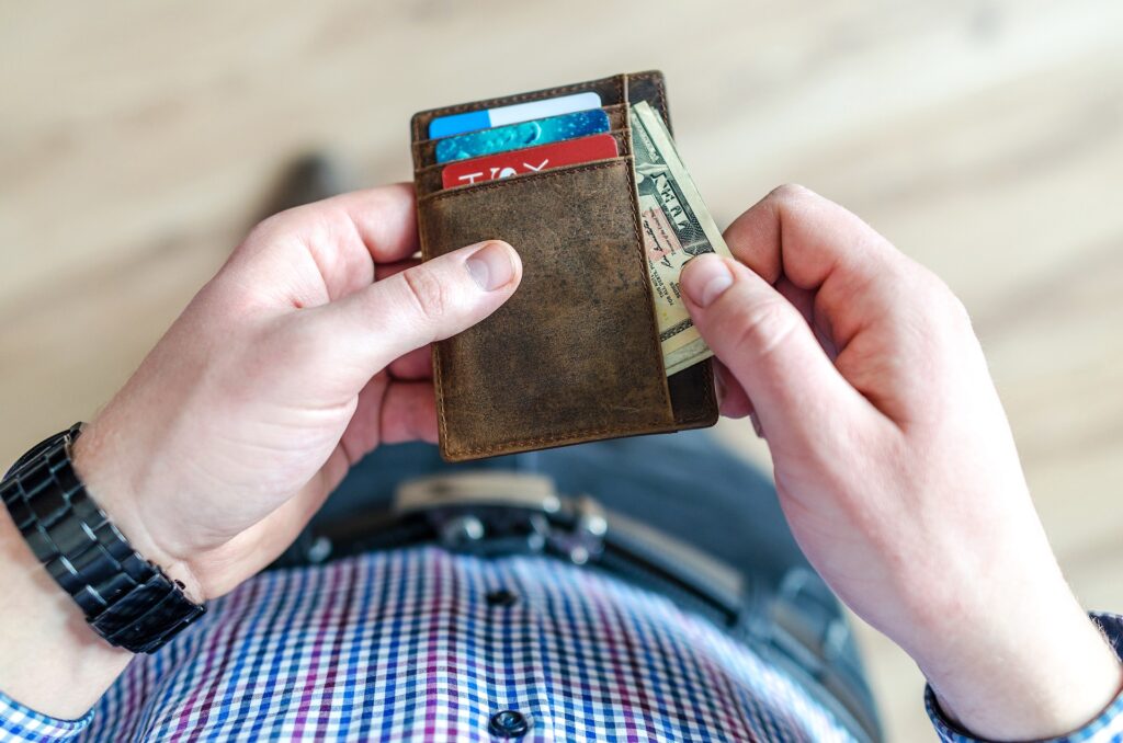 Person holding wallet.