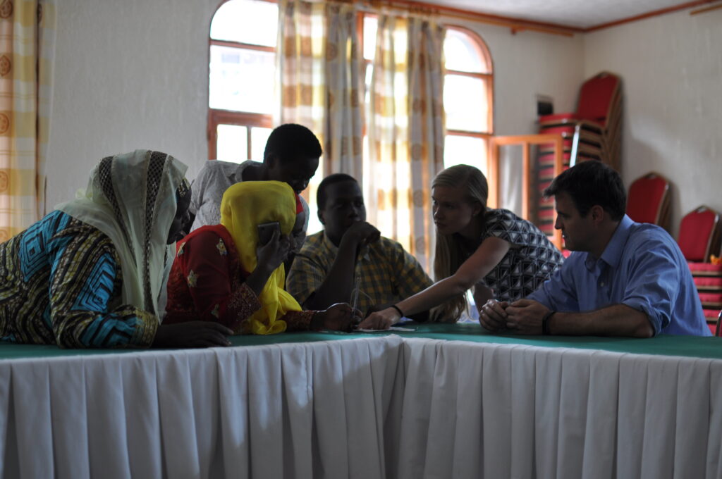 Leaf’s Tori Samples and Nat Robinson meeting with refugees in Rwanda.