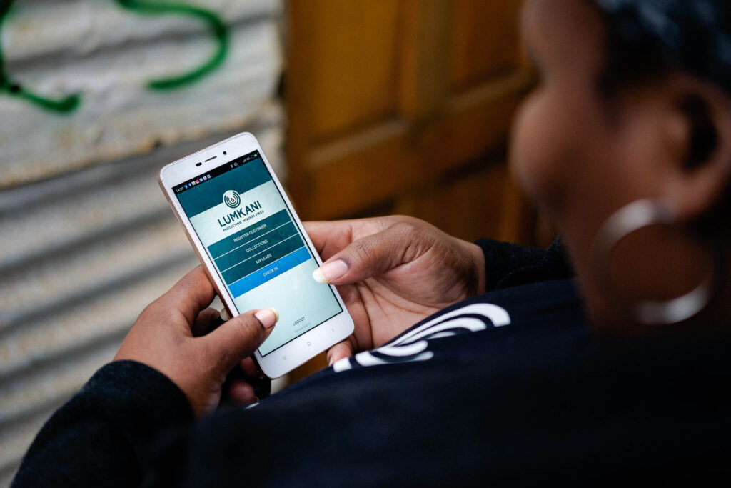 Woman accesses Lumkani's platform from her mobile phone