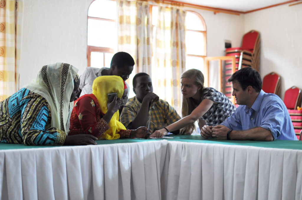 Leaf’s Tori Samples and Nat Robinson meeting with refugees in Rwanda.