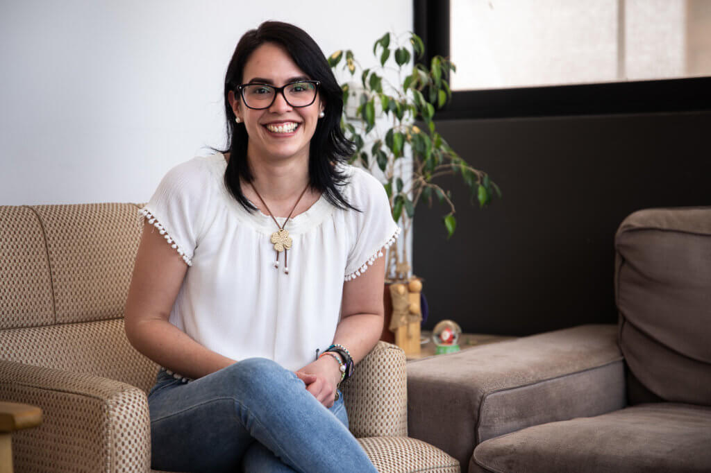 Virginia Chacón sitting inside Destacame's office