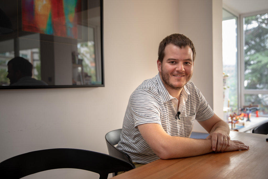 Nicolas Jaramillo sitting at a table in his office