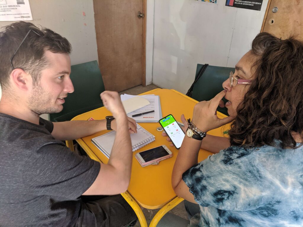 Organizame employee demonstrates app to client