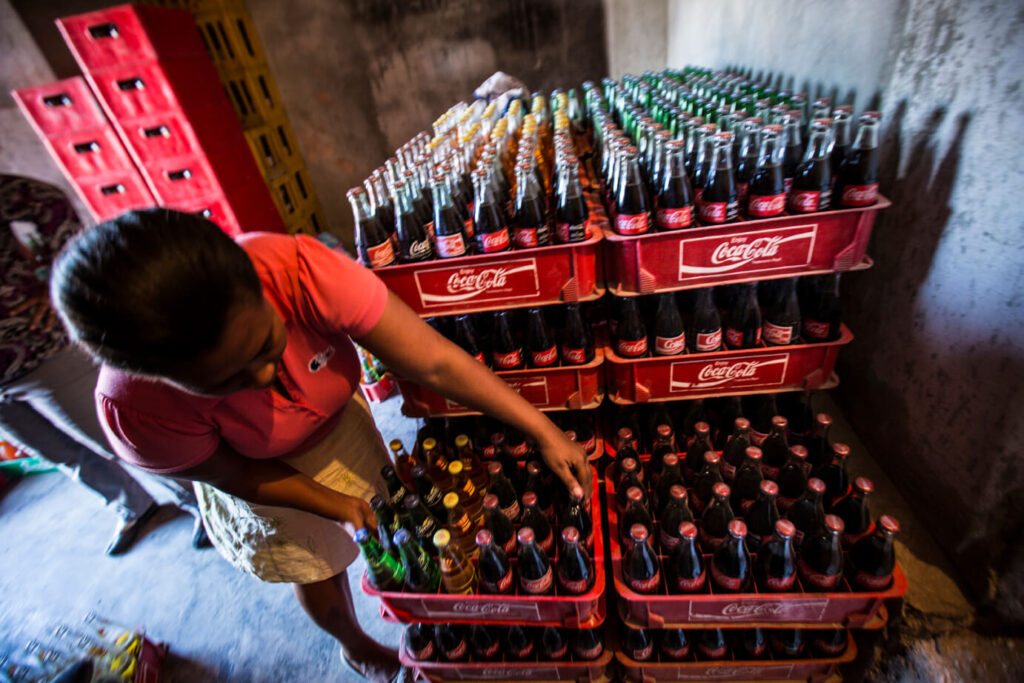 woman unloads products to sell in her shop