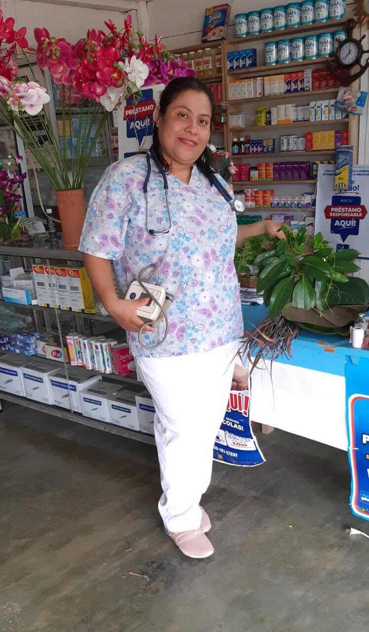 Jovita stands in the health center that she opened in her rural community in northern Guatemala