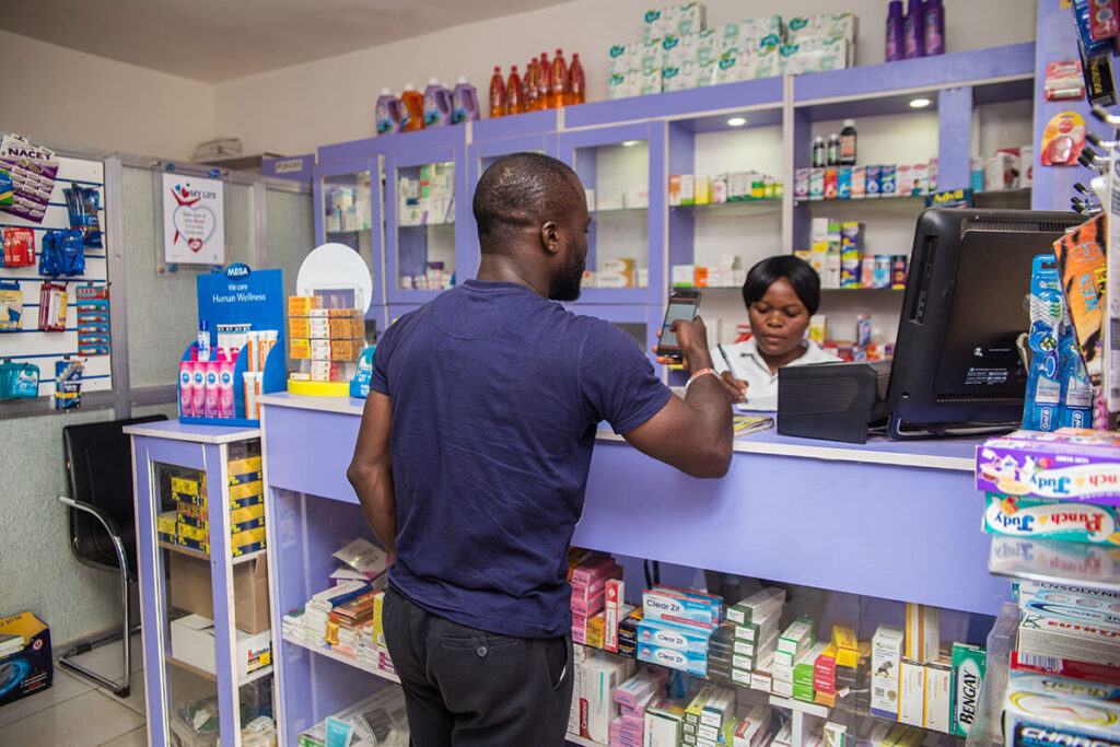 Field Intelligence staff visits pharmacy client in Abuja