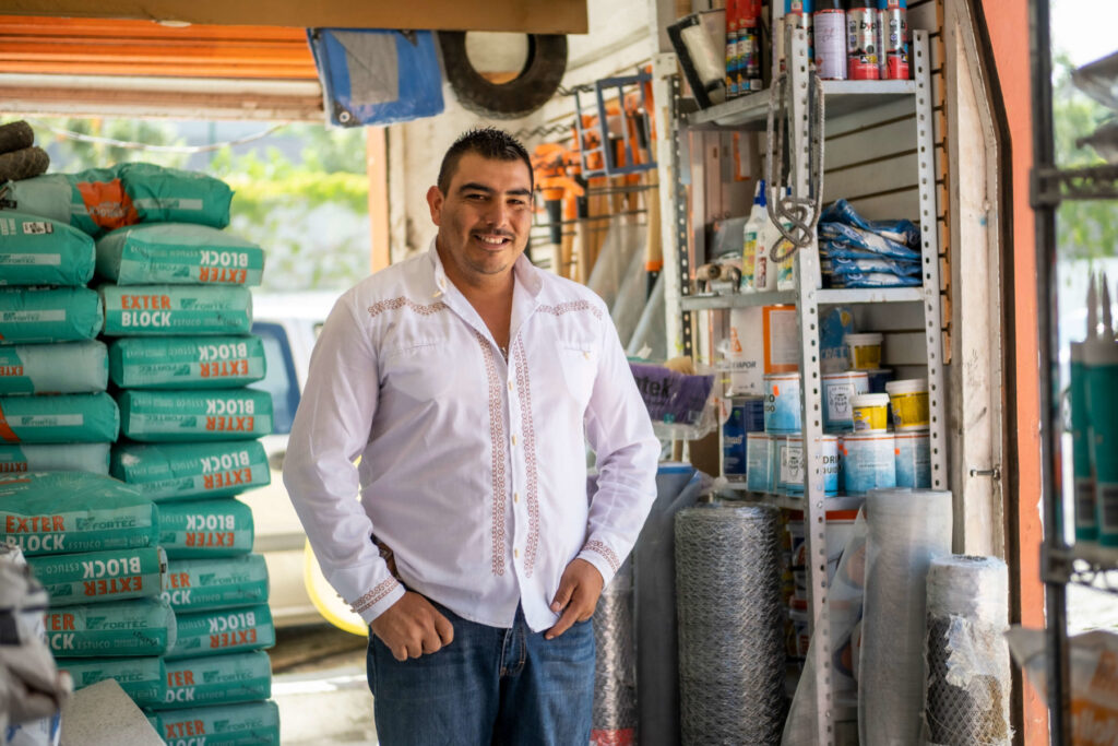 Jorge Luis, Caja Bienestar client, stands in his shop