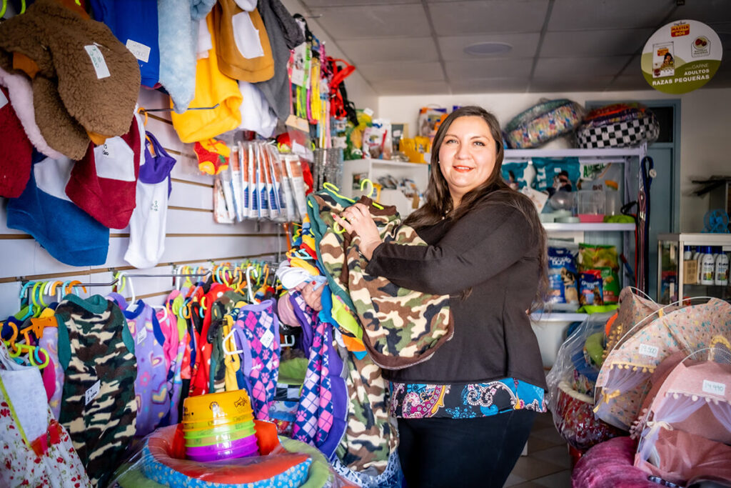 Daniela stands in her small shop in Santiago, Chile