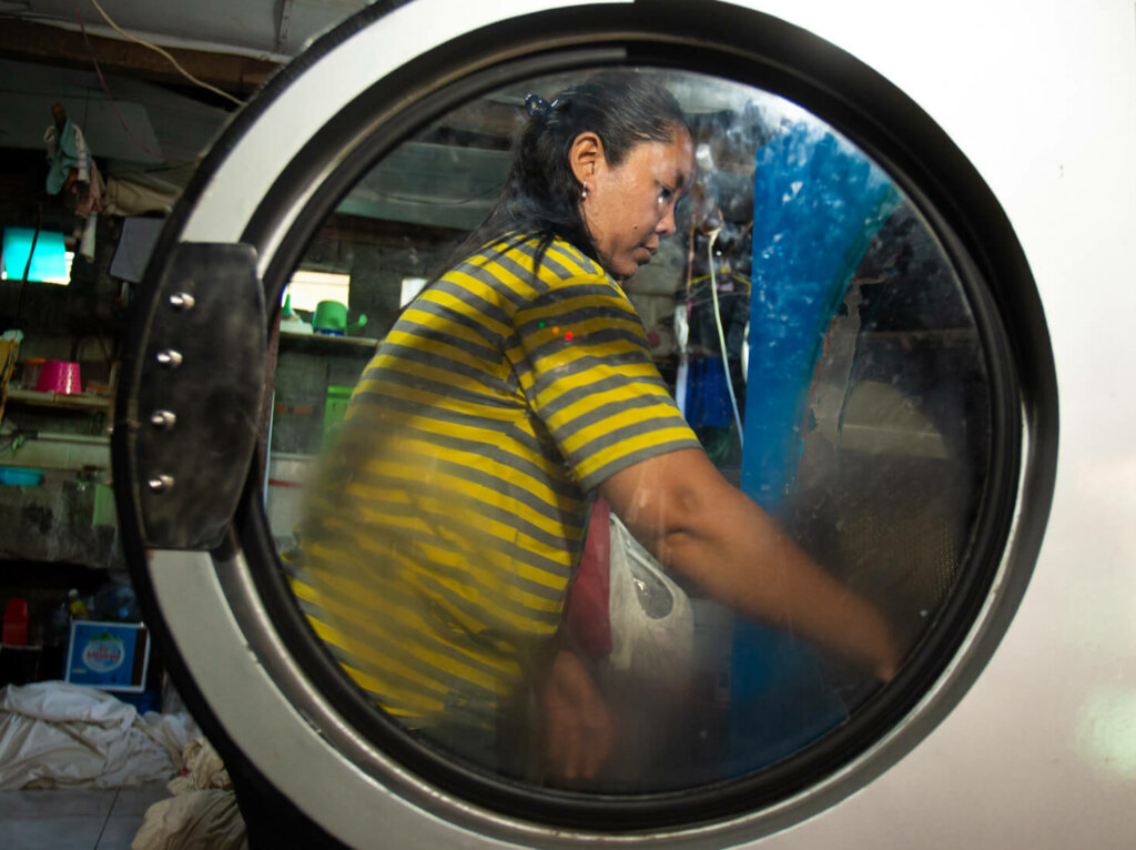 Desi, laundry business owner, Bina Artha Ventura client