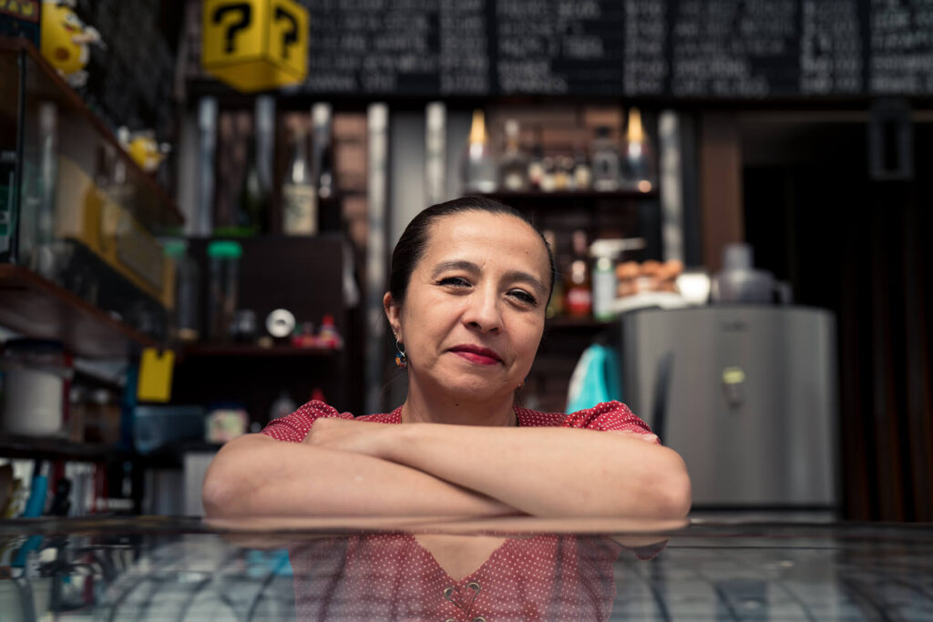 Claudia at her dessert counter in Bogota