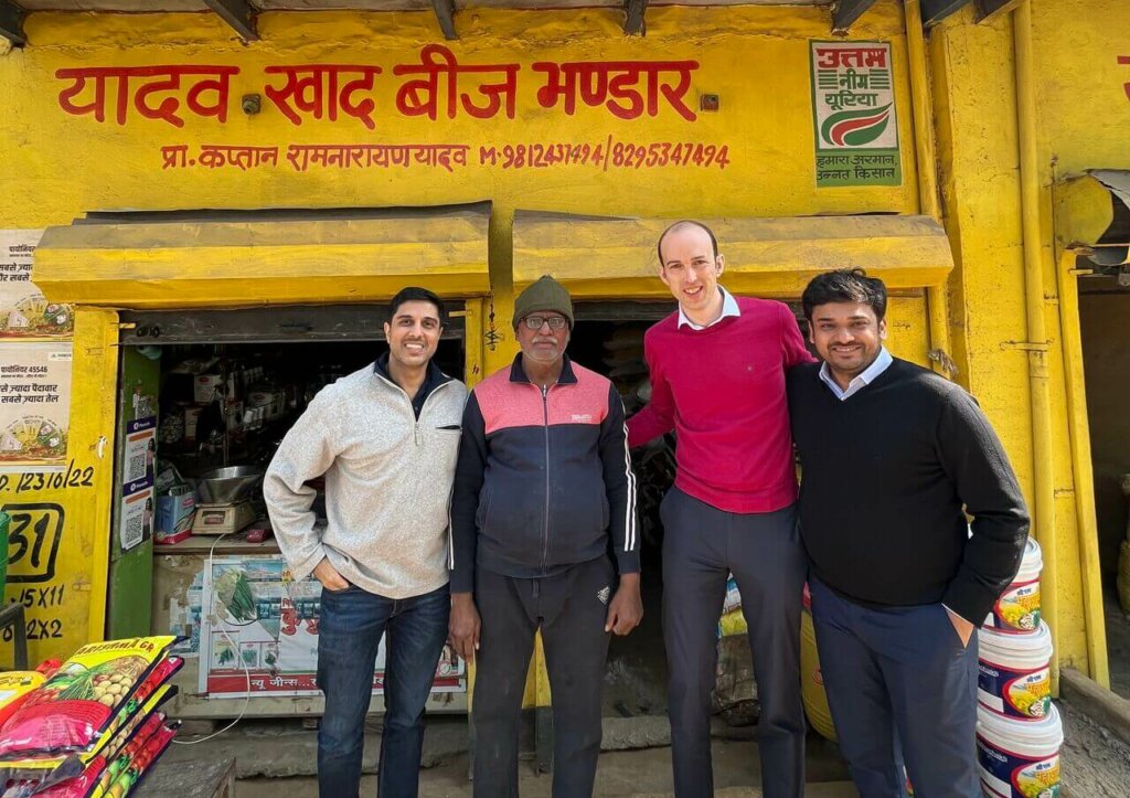 Accion and Agrim employees standing in front of a store