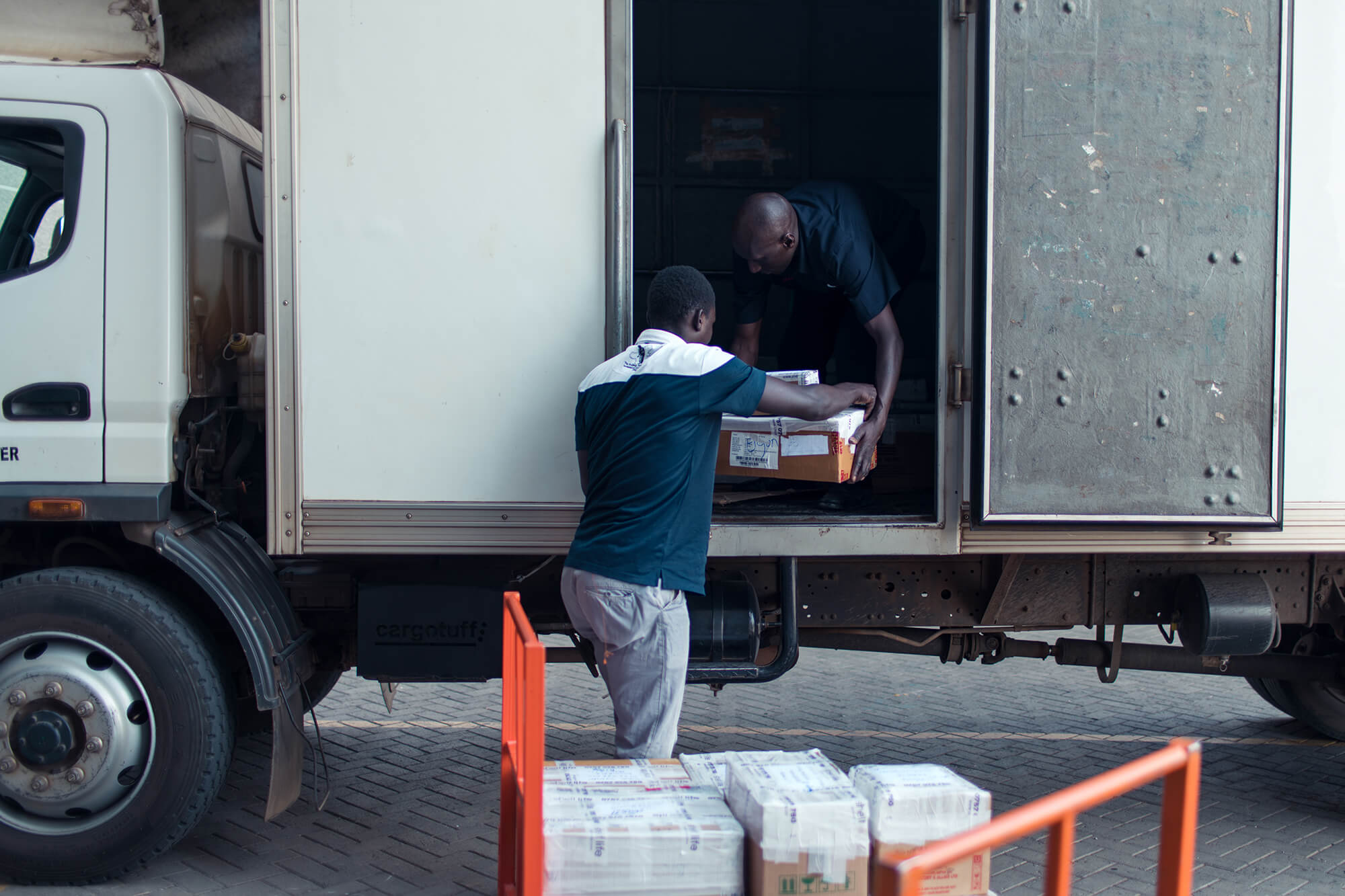 Field employees loading truck in Kenya