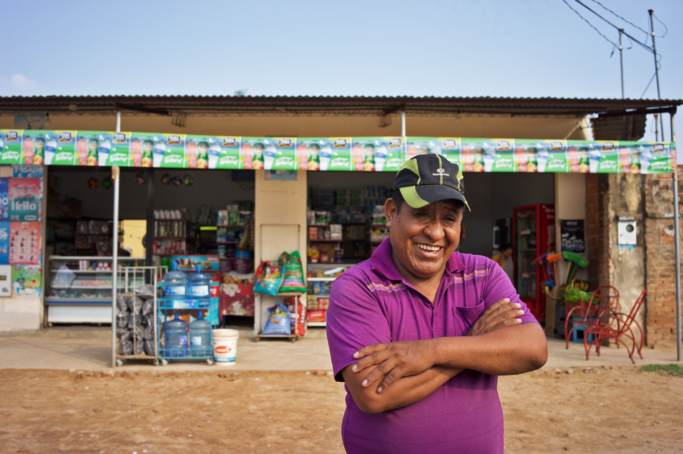 Constantino stands in front of his store in Bolivia