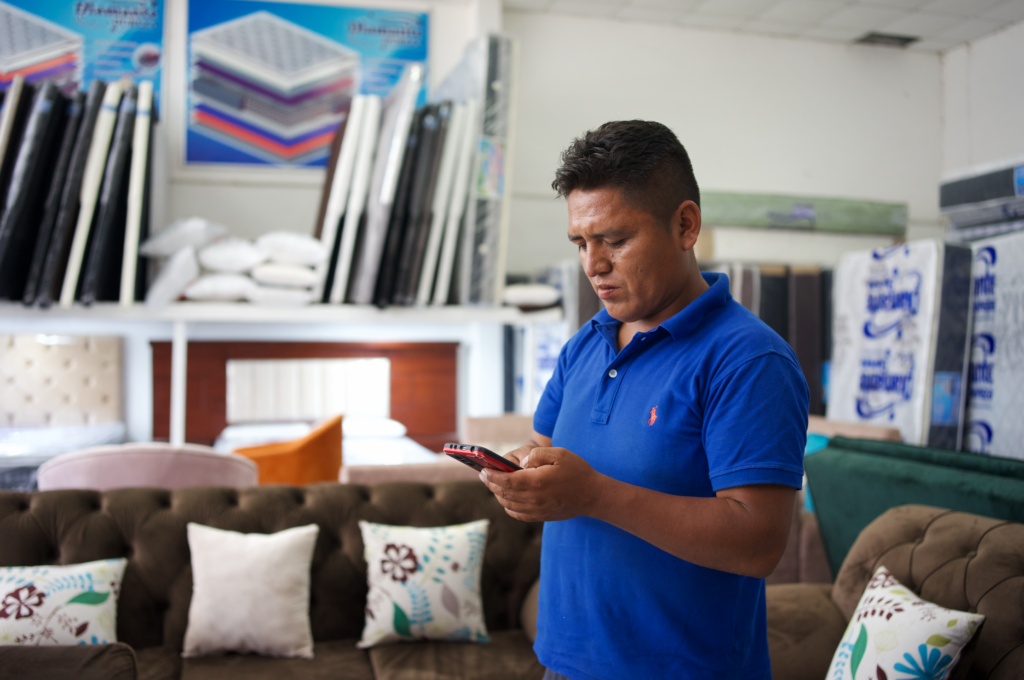 Doroteo manages his business' finances using his phone