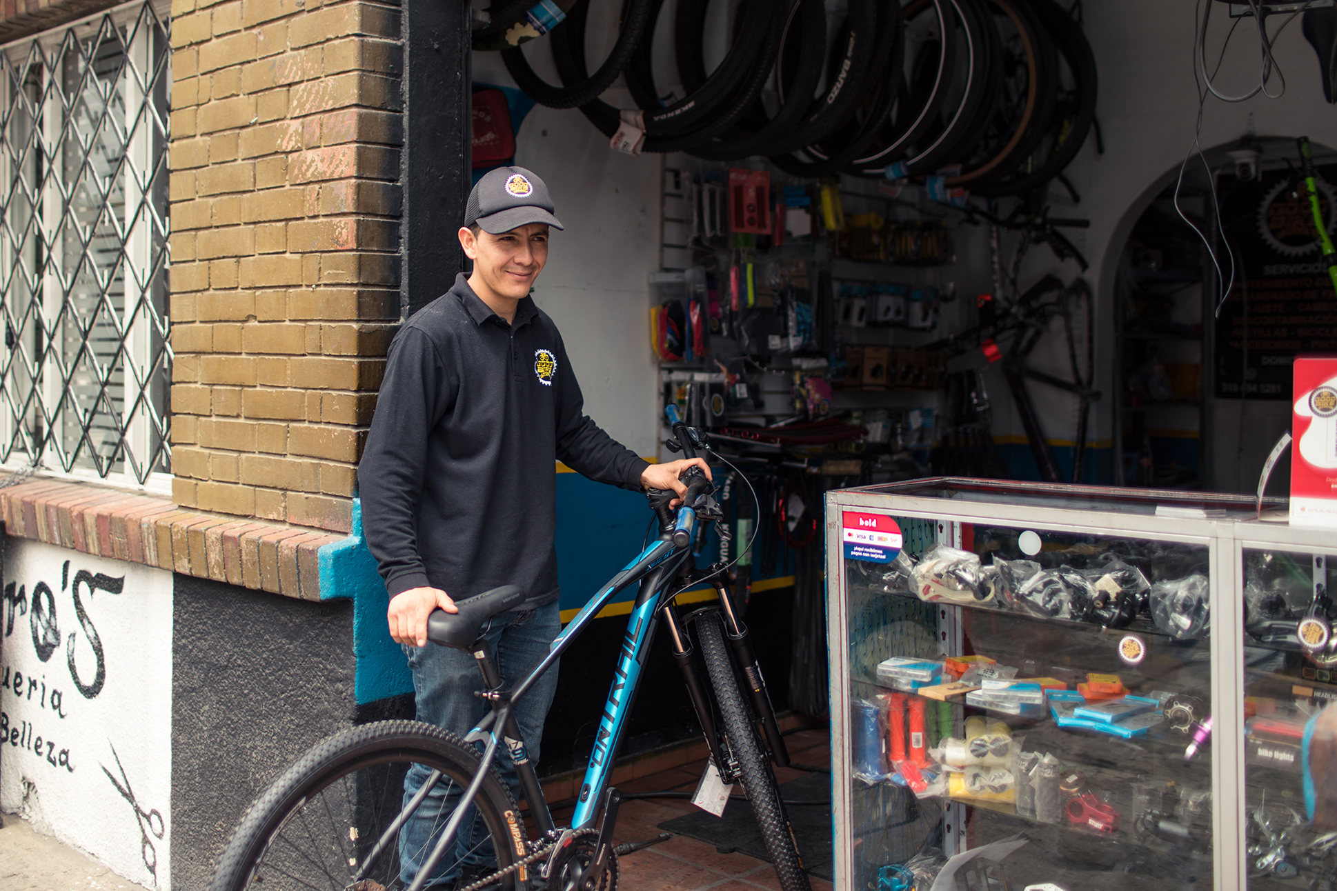 Julian working at his bike repair shop in Bogota, Colombia