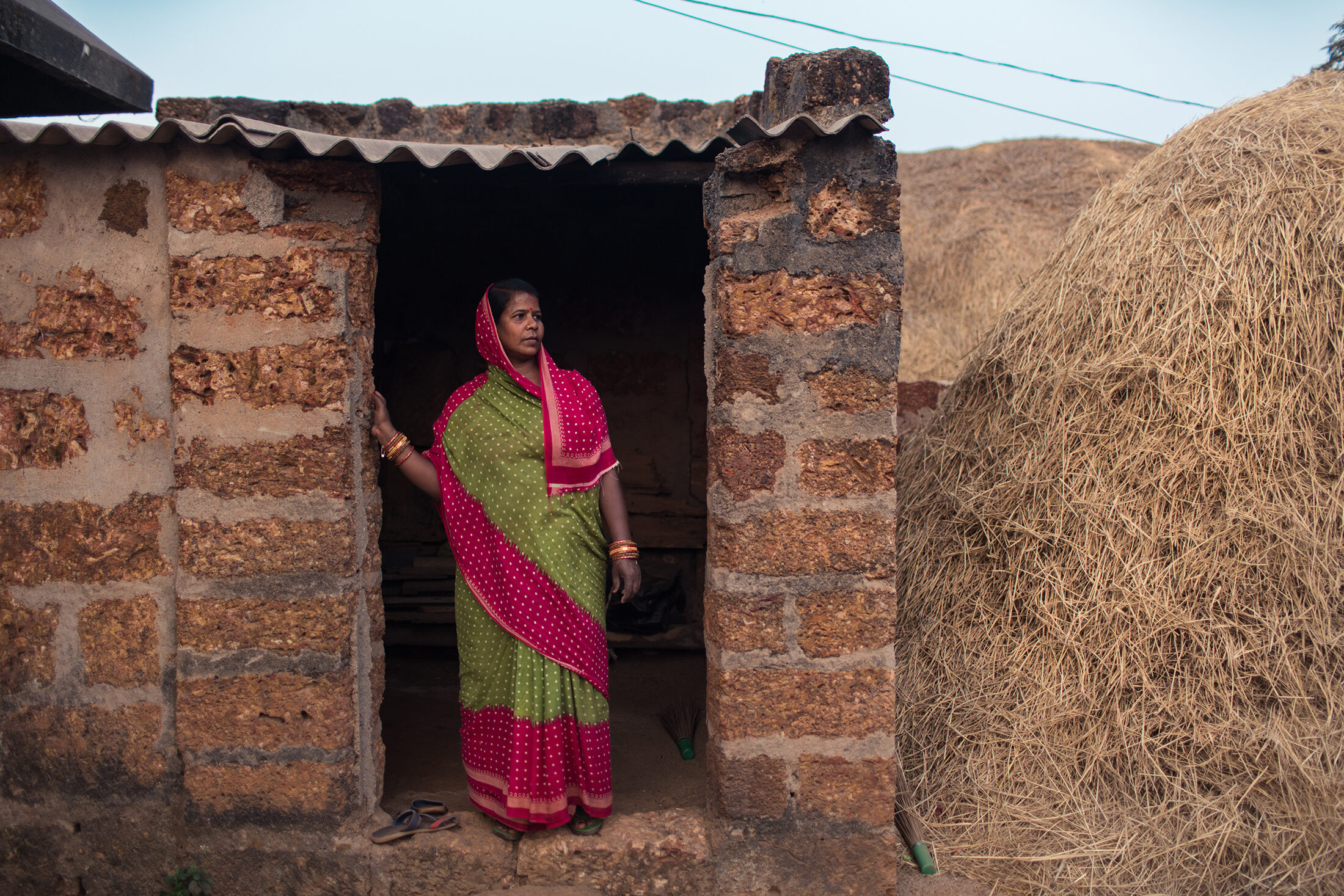 Renuka looks out on her farm in Odisha, India