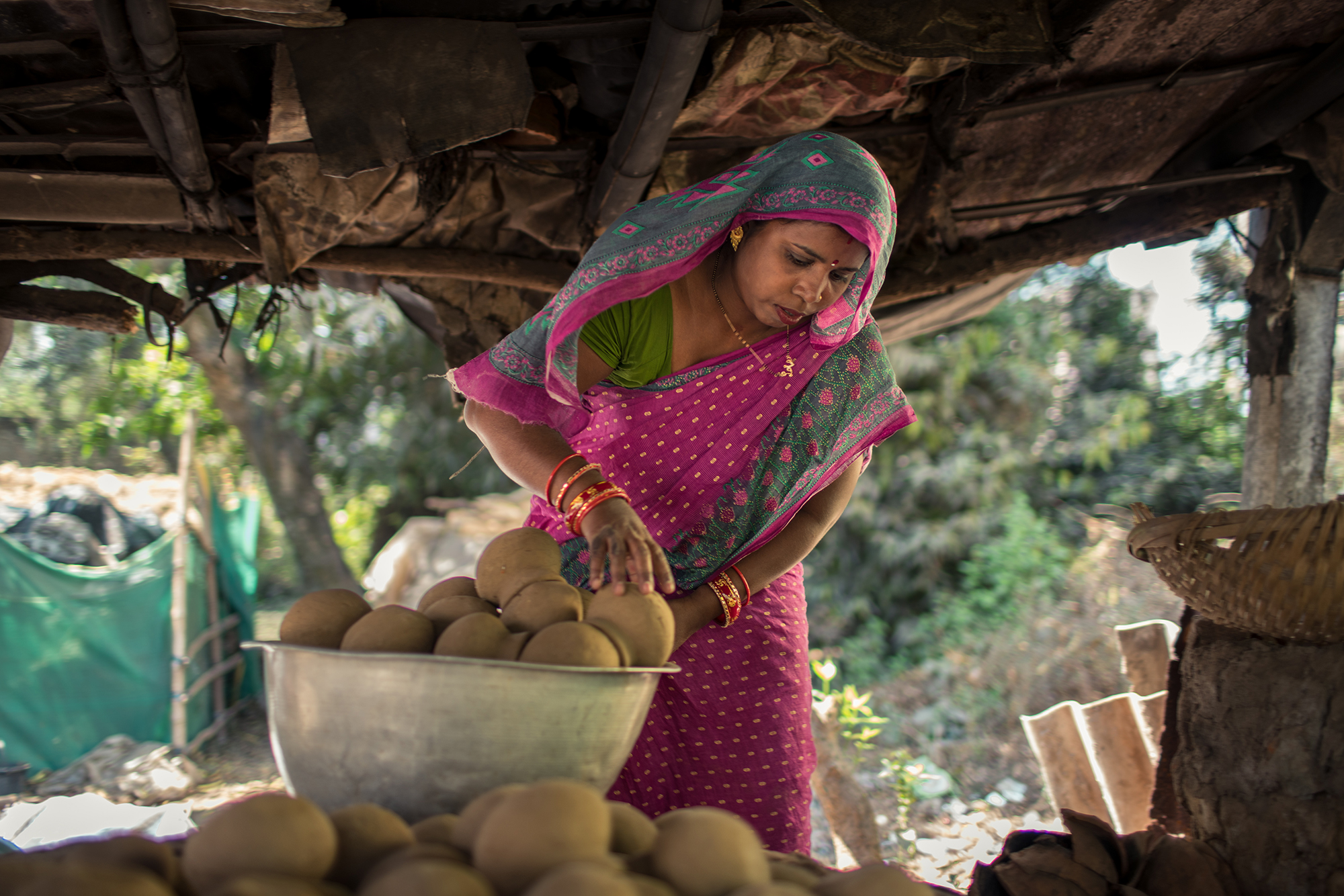 Rina works on her pottery in Odisha, India
