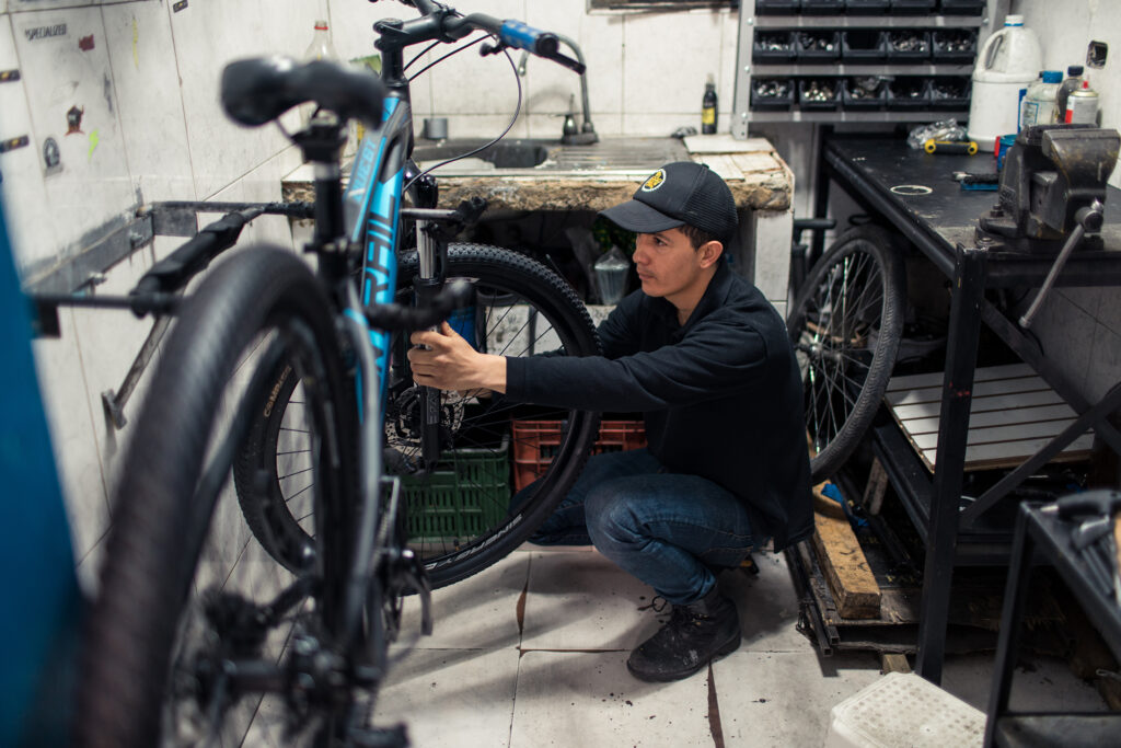 Julian at his bicycle repair shop in Bogotá, Colombia