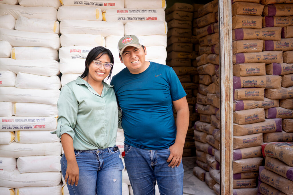 Roselin and her husband at their business in Bolivia