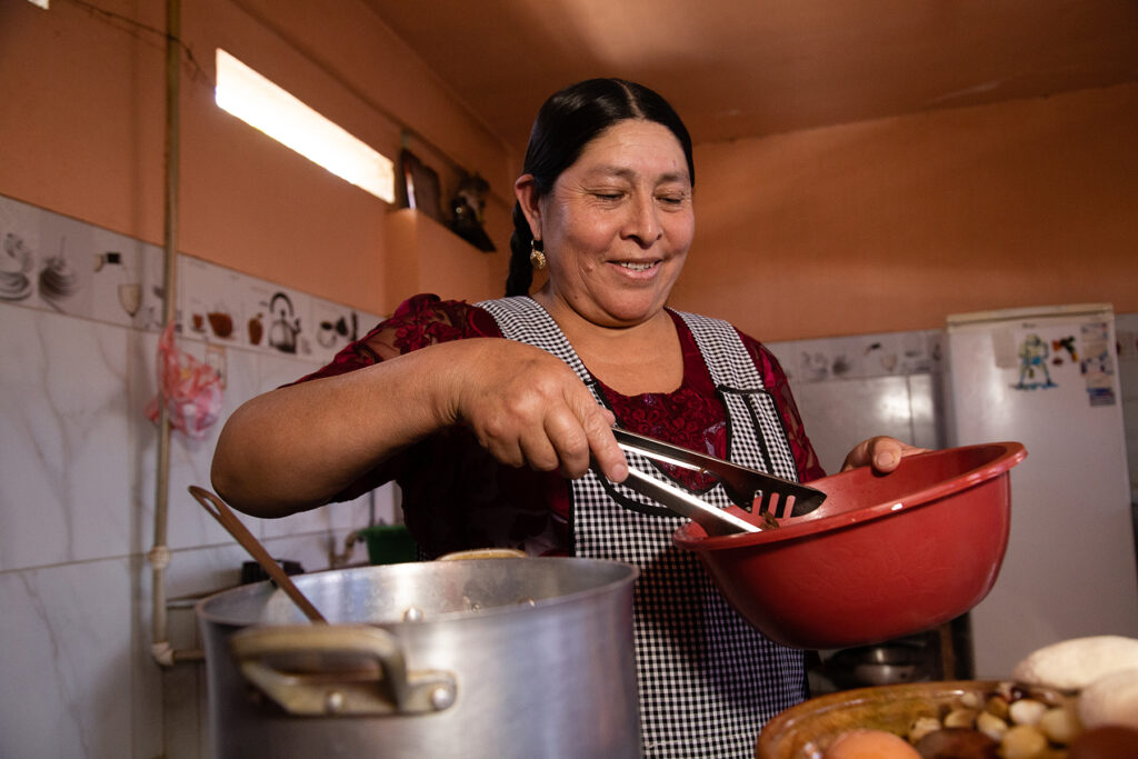 Arminda cooks at her restaurant in Bolivia