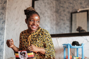Fatuma sews a bag at her salon