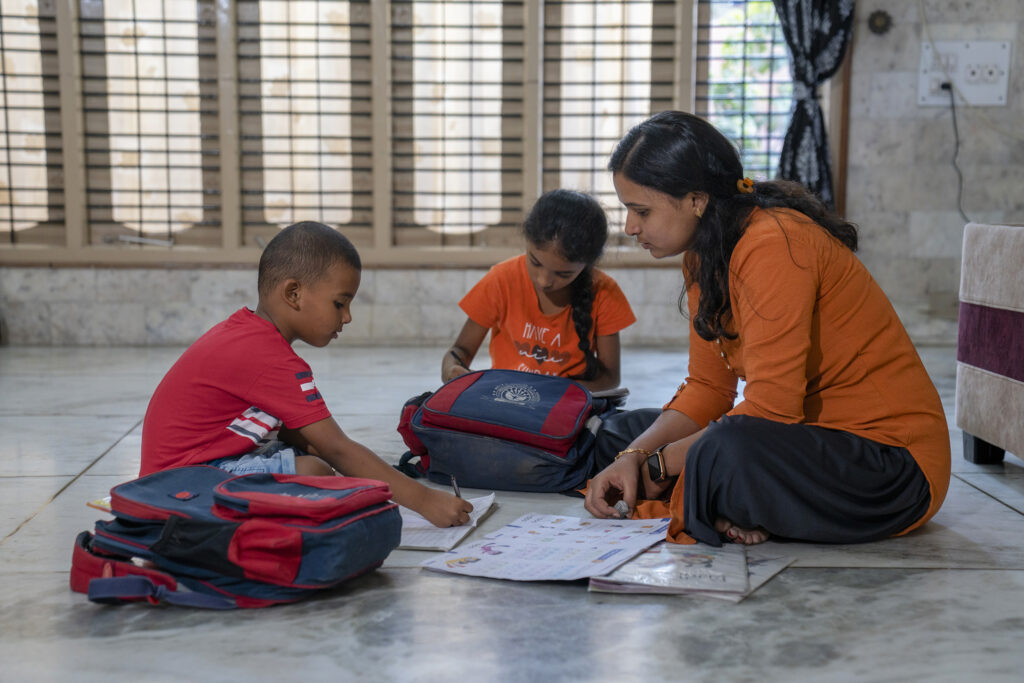 Sneha helps her children study