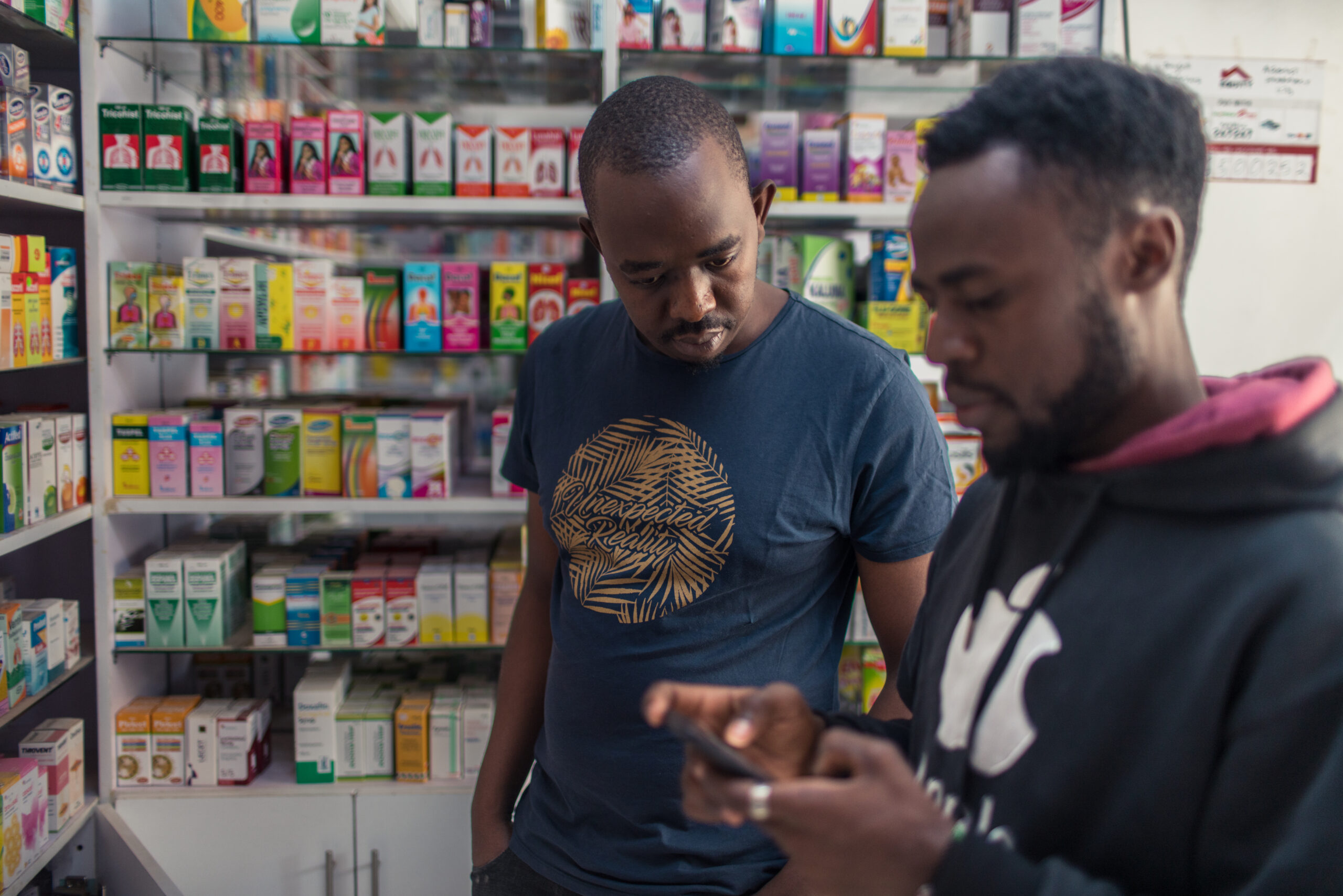 Pharmacy owner in Kenya using Field Intelligence’s embedded finance solution to manage inventory and payments.