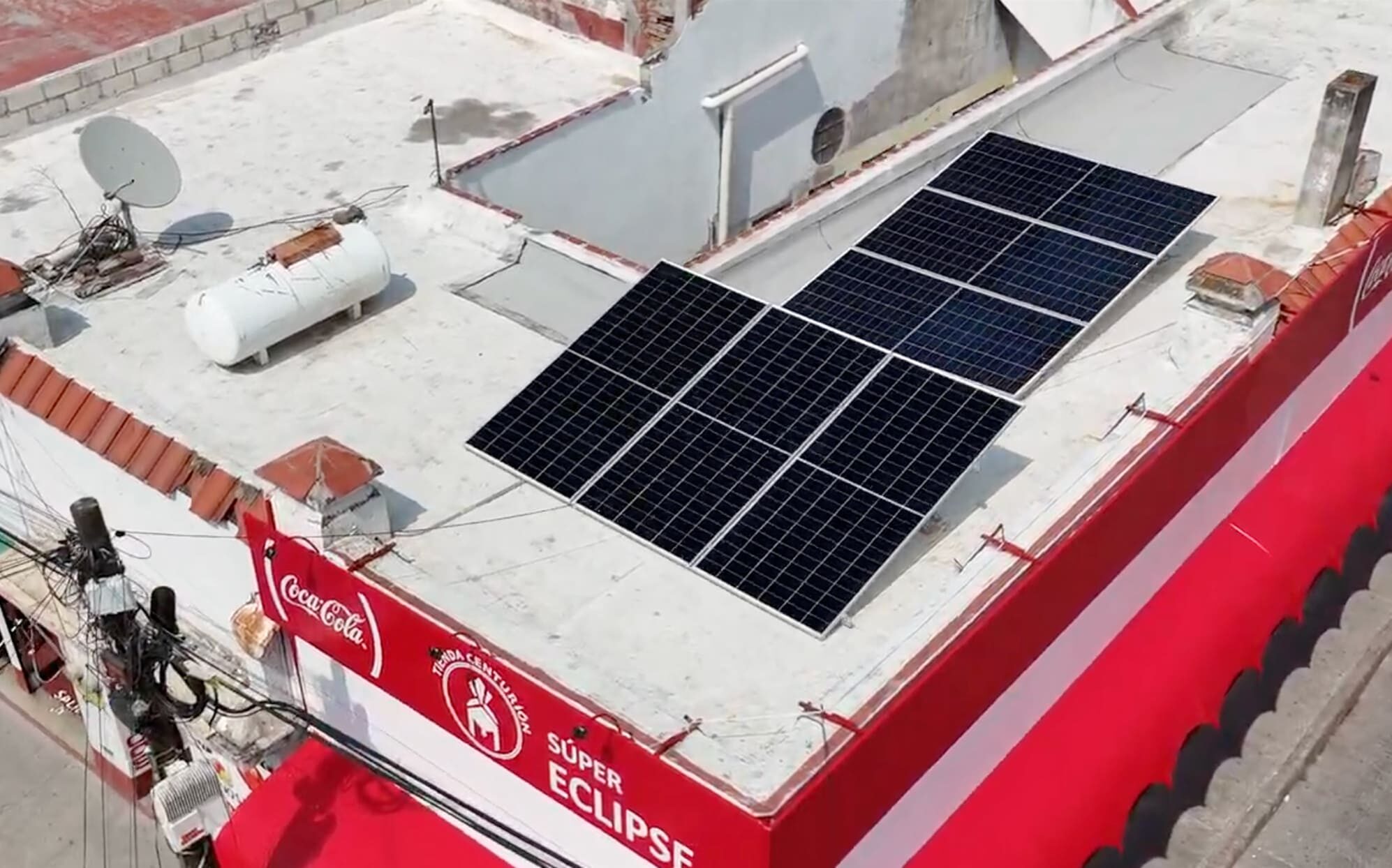 Solar panels installed on the roof of a neighborhood convenience store.
