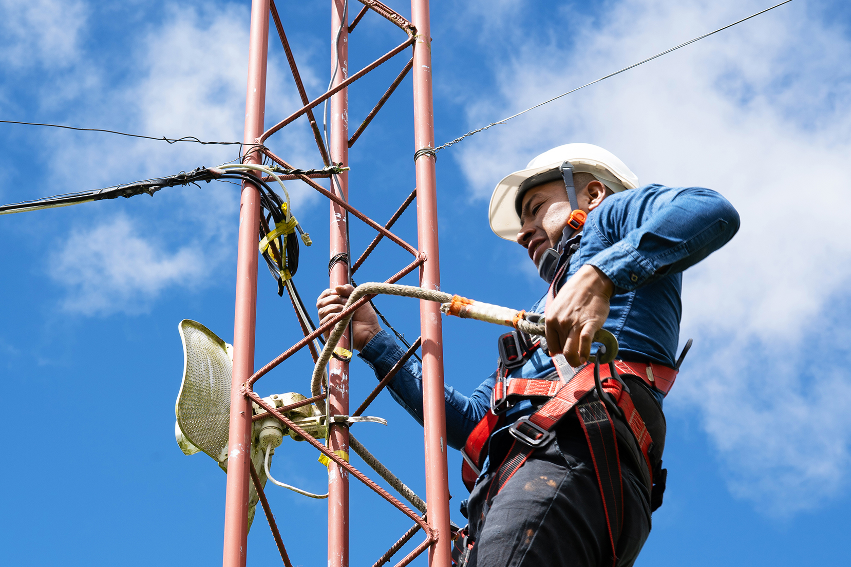 Jhon Jairo inspects his internet cables