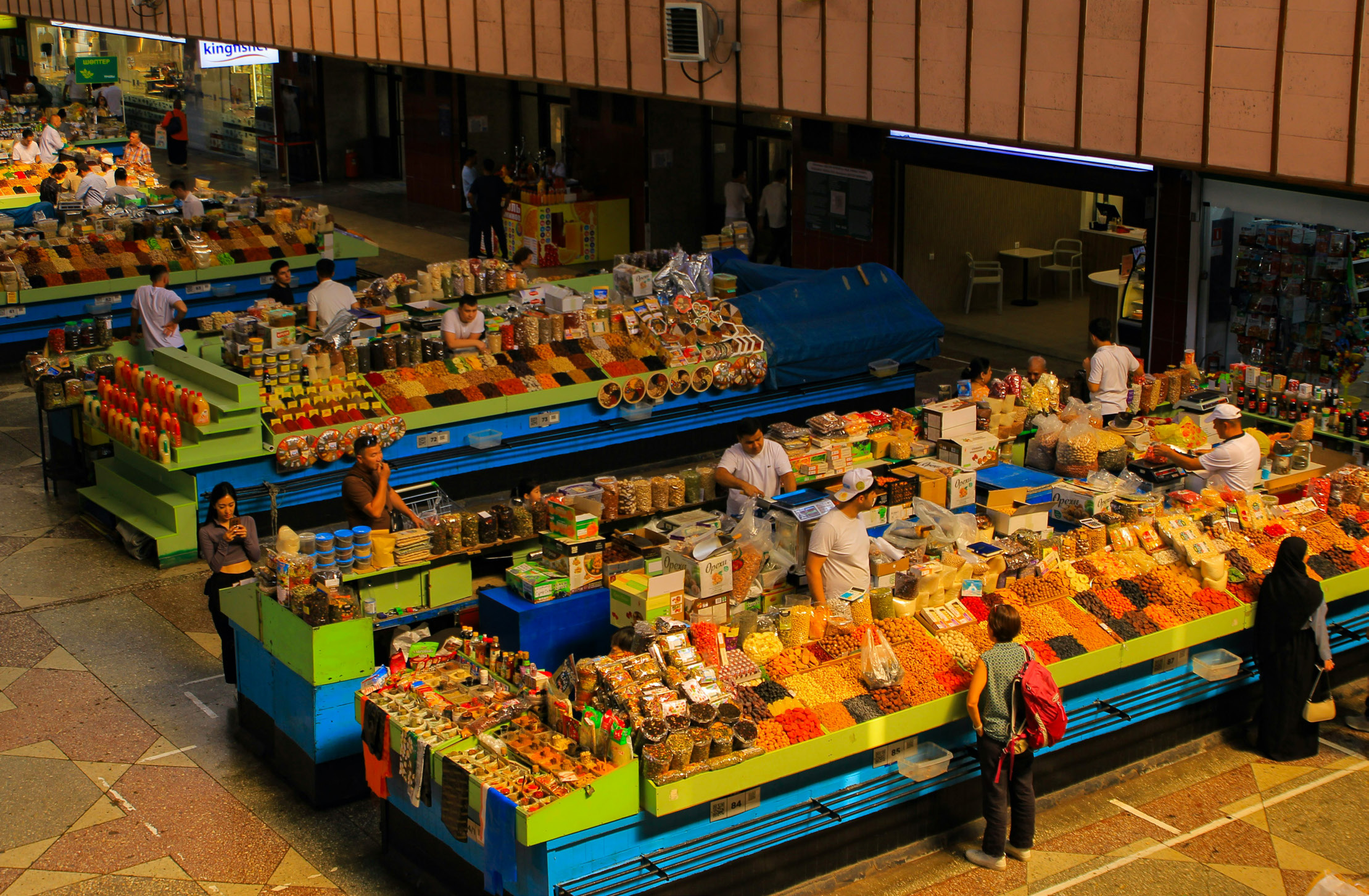 A central market hall in Almaty, Kazakhstan. Photo by Gwangjin Go on Unsplash.