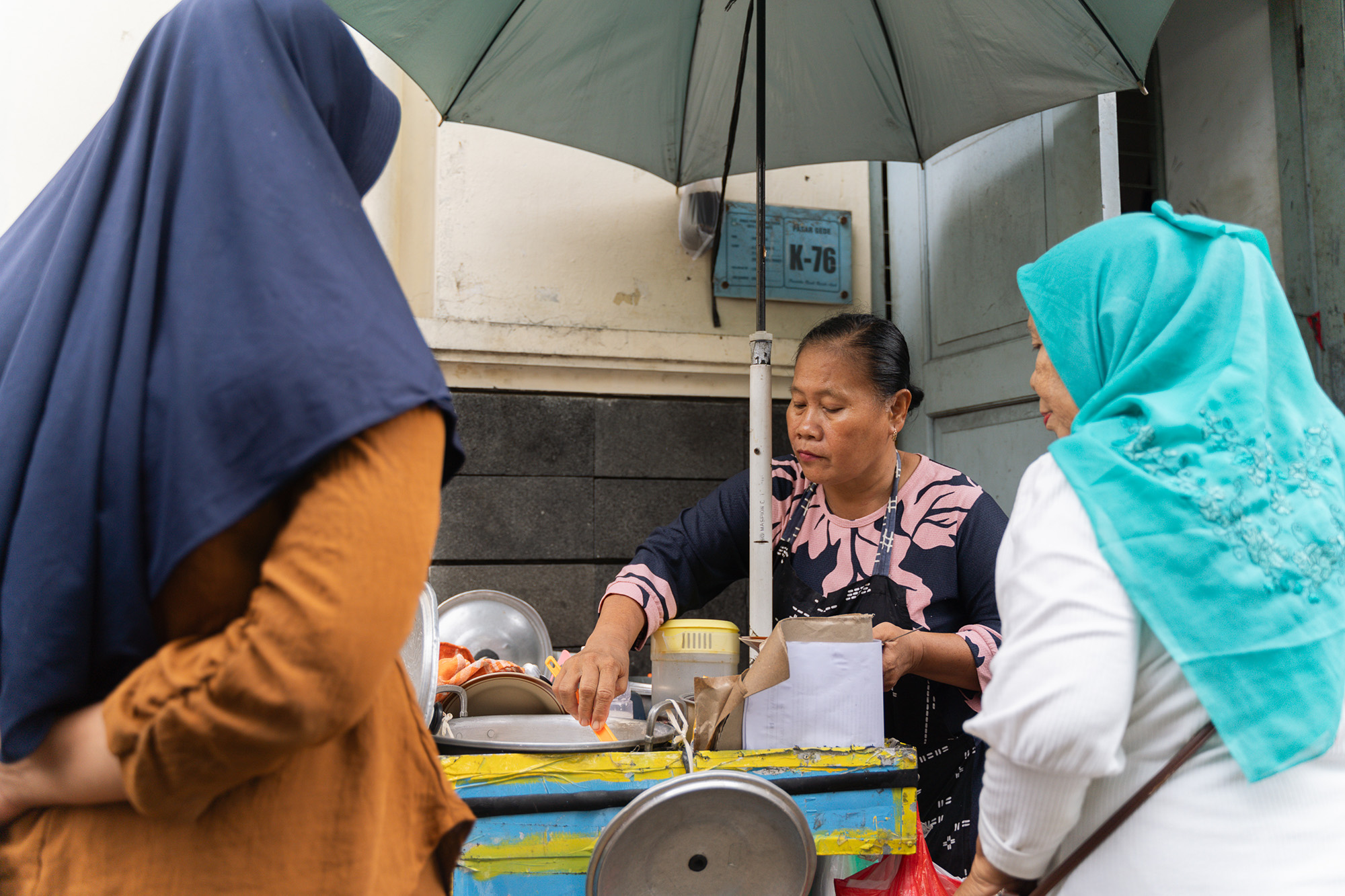 Raheni serves porridge to her customers