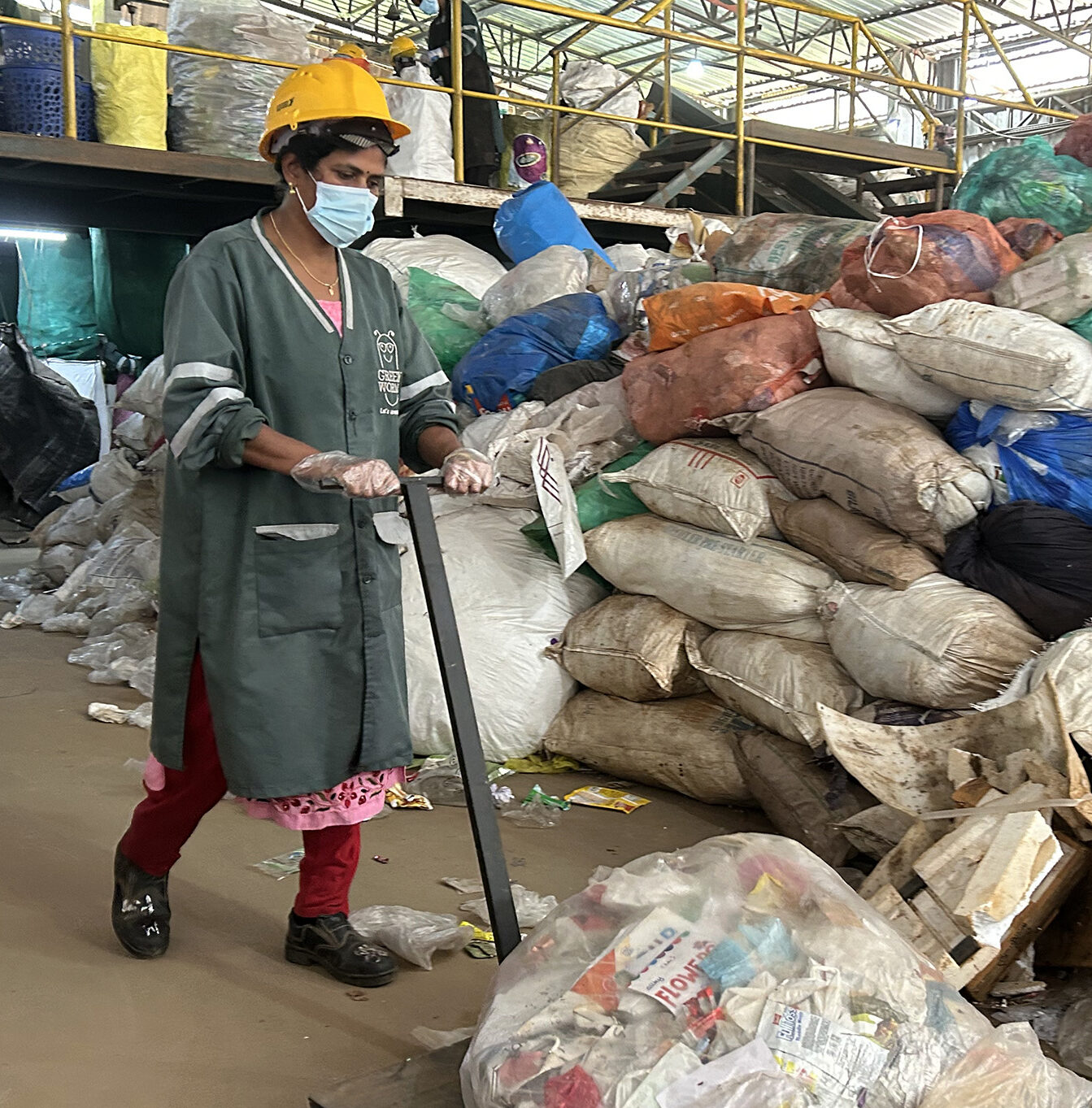 Mini P.S. works at the Green Worms recycling facility